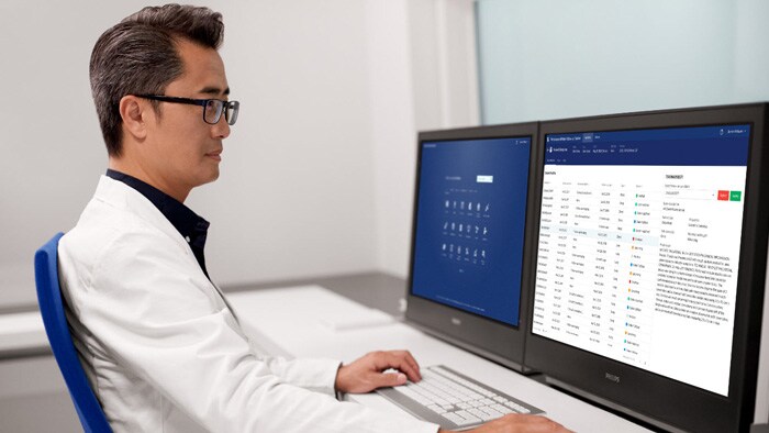 Clinician viewing an on-screen report to bridge the gap between data and decision-making